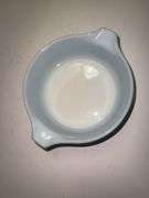 Vintage Pyrex Amish Butterprint turquoise with white design casserole dish with a lid.