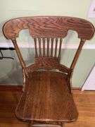 Vintage solid wood swivel bar stool.