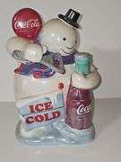 Coca-Cola Snowman using a bottle opener cookie jar.