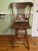 Vintage solid wood swivel bar stool.