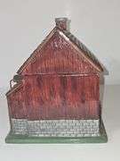 Coca-Cola barn-shaped ceramic cookie jar.