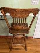 Vintage solid wood swivel bar stool.