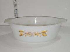 Fire-King casserole dish with the "Golden Wheat" pattern.