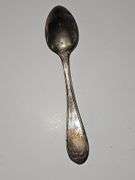 Silver colored cup and flatware