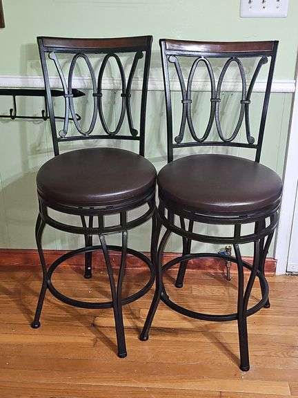 2 Black metal swivel bar stool with a dark brown cushioned seat.