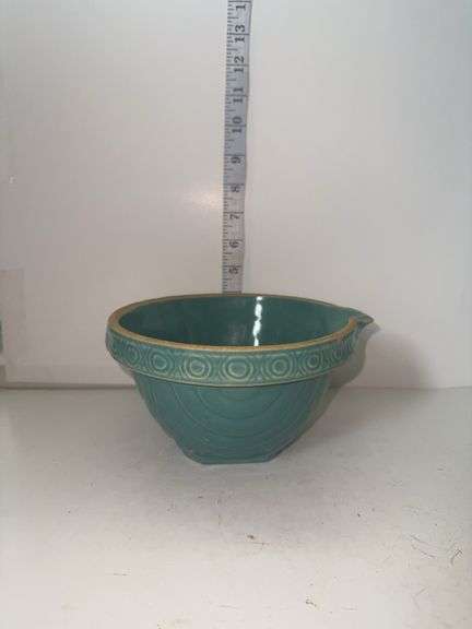 Aqua colored stoneware mixing bowl with spout.
