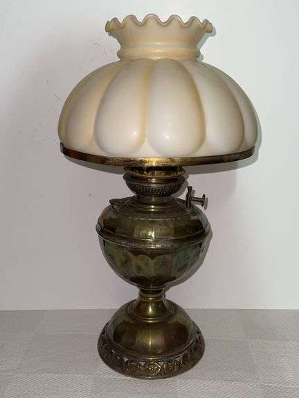 Vintage brass hurricane lamp with milk glass shade
