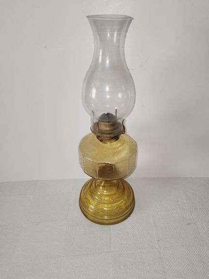 Oil lamp with amber-colored glass with a textured, "bubble" with clear glass chimney