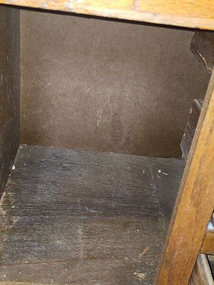 Solid oak gun cabinet with glass doors and a lower storage area with drawers