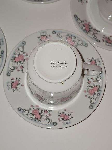 Porcelain tea cups & saucers with rose design
