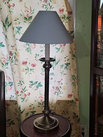 Empire-style brass and ebonized candlestick buffet lamp.