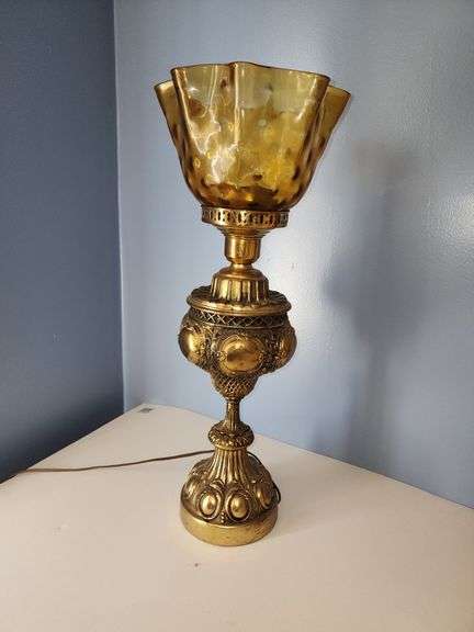 Vintage-style brass parlor lamp with amber colored shade
