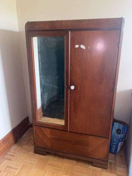 Wooden armoire with a mirrored door