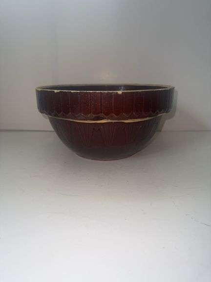 Vintage stoneware mixing bowl with a brown glaze and picket fence design. USA 9n the bottom