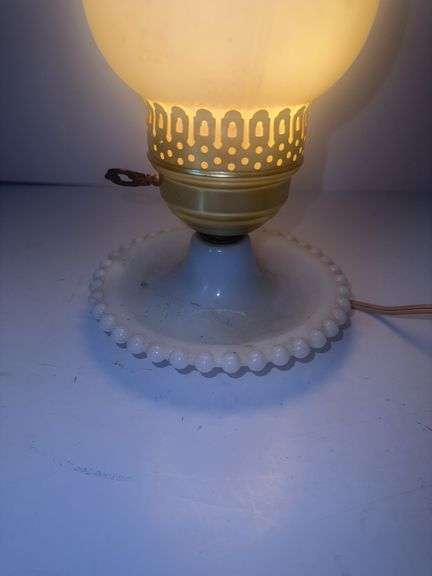 Vintage milk glass table lamp with a ruffled base