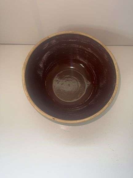 Vintage stoneware mixing bowl with a brown glaze and picket fence design. USA 9n the bottom