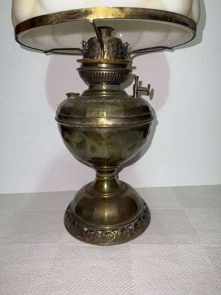 Vintage brass hurricane lamp with milk glass shade