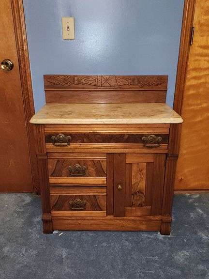 Vintage walnut washstand with a marble top.