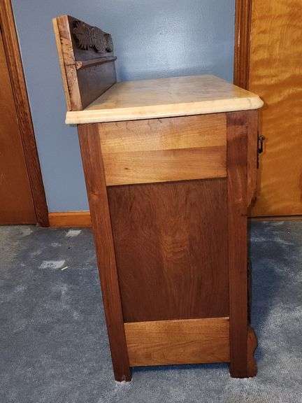 Vintage walnut washstand with a marble top.