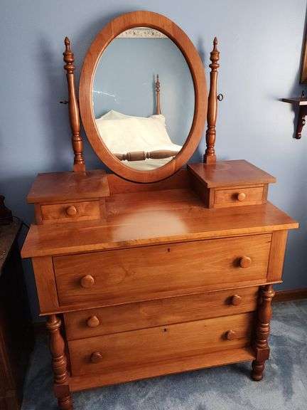 Cherry dresser with oval mirror