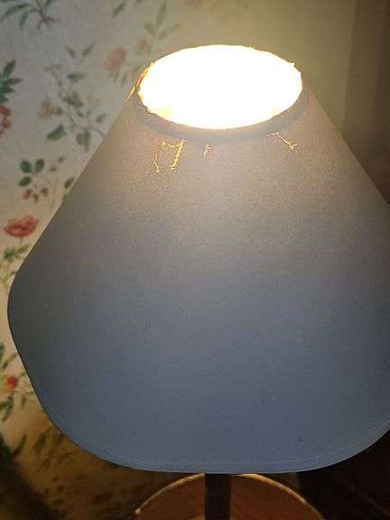 Empire-style brass and ebonized candlestick buffet lamp.