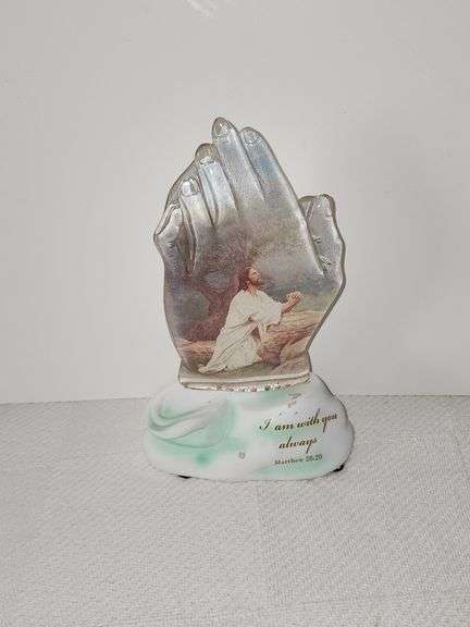 Framed print of Jesus, musical figurine, praying hands, & shelf.