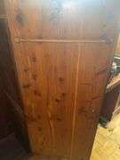 Wooden armoire with a mirrored door