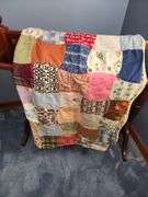 Handmade multicolored quilt & cherry quilt stand