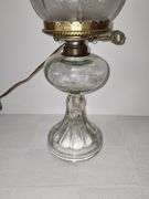 Clear glass oil lamp with electric