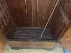 Wooden armoire with a mirrored door