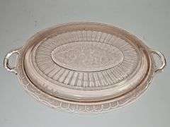 Vintage pink depression glass oval serving platter.