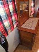 Antique American Eastlake three-drawer oak dresser with a carved mirror