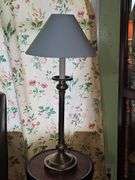 Empire-style brass and ebonized candlestick buffet lamp.