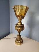 Vintage-style brass parlor lamp with amber colored shade