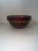 Vintage stoneware mixing bowl with a brown glaze and picket fence design. USA 9n the bottom