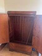 Wooden armoire with a mirrored door