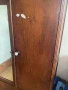 Wooden armoire with a mirrored door