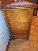 Antique American Eastlake three-drawer oak dresser with a carved mirror