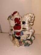 Santa on rocking horse - made in China