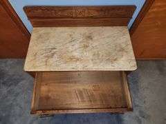 Vintage walnut washstand with a marble top.