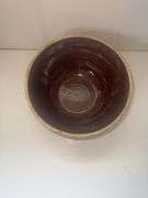 Vintage stoneware mixing bowl with a brown glaze and picket fence design. USA 9n the bottom