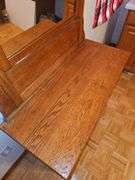 Antique American Eastlake three-drawer oak dresser with a carved mirror