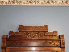 Victorian Eastlake walnut dresser with a marble top and a mirror.