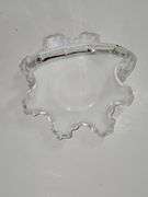 Vintage Fenton Silver Crest ruffled milk glass basket with a clear handle