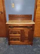 Vintage walnut washstand with a marble top.