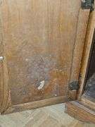 Solid oak gun cabinet with glass doors and a lower storage area with drawers