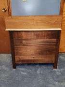 Vintage walnut washstand with a marble top.