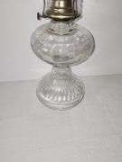 Clear glass oil lamp with fluted or ribbed pattern base & clear glass chimney