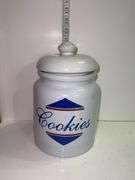 Vintage white ceramic cookie jar .