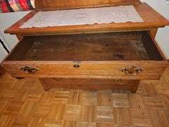 Antique American Eastlake three-drawer oak dresser with a carved mirror